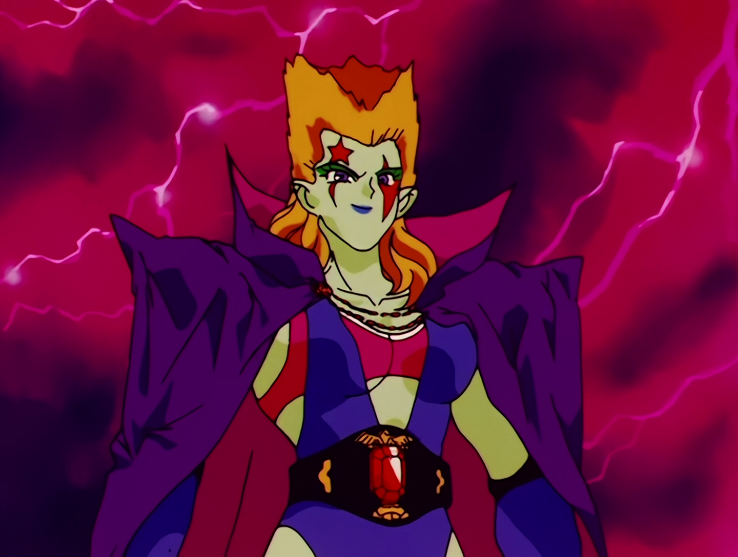 Dumbull, a Droid from Sailor Moon episode 63. She has light green skin and an orange spiked mullet. Yeah, I’m as surprised as you that the only monster with a mullet ended up at number one. She’s wearing a blue and red wrestling outfit with a purple cape and black belt. She also has red symbols painted on her face.